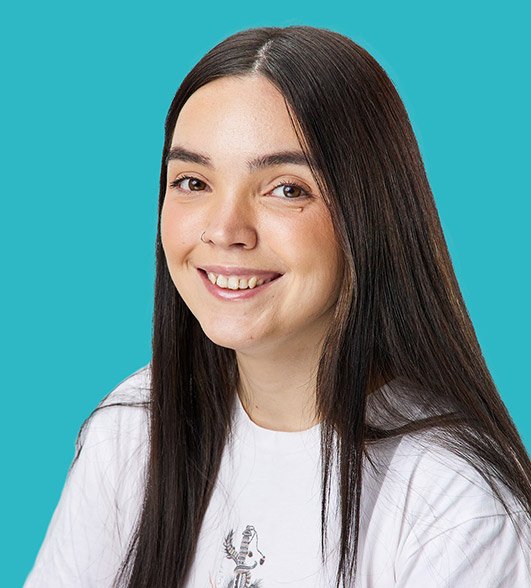 a headshot of Mollie a woman with long dark hair