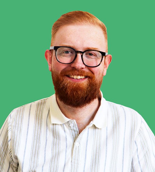 a headshot of Steve a man with red hair and a beard