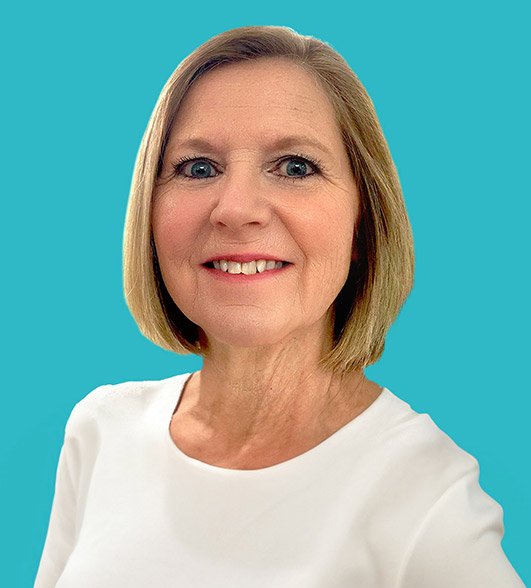 a headshot of Elaine a woman with a blonde bob